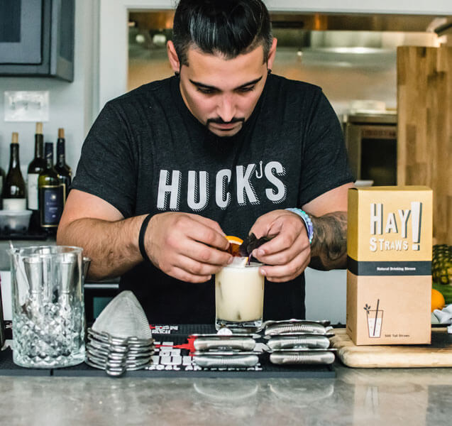 Bartender making cocktail with sustainable straws from StrawZ
