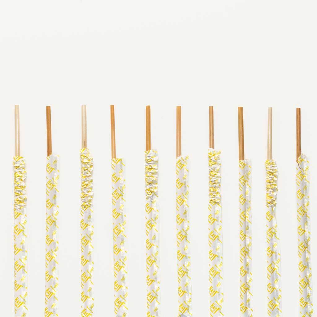 couple of biological tall size paper wrapped wheat straws