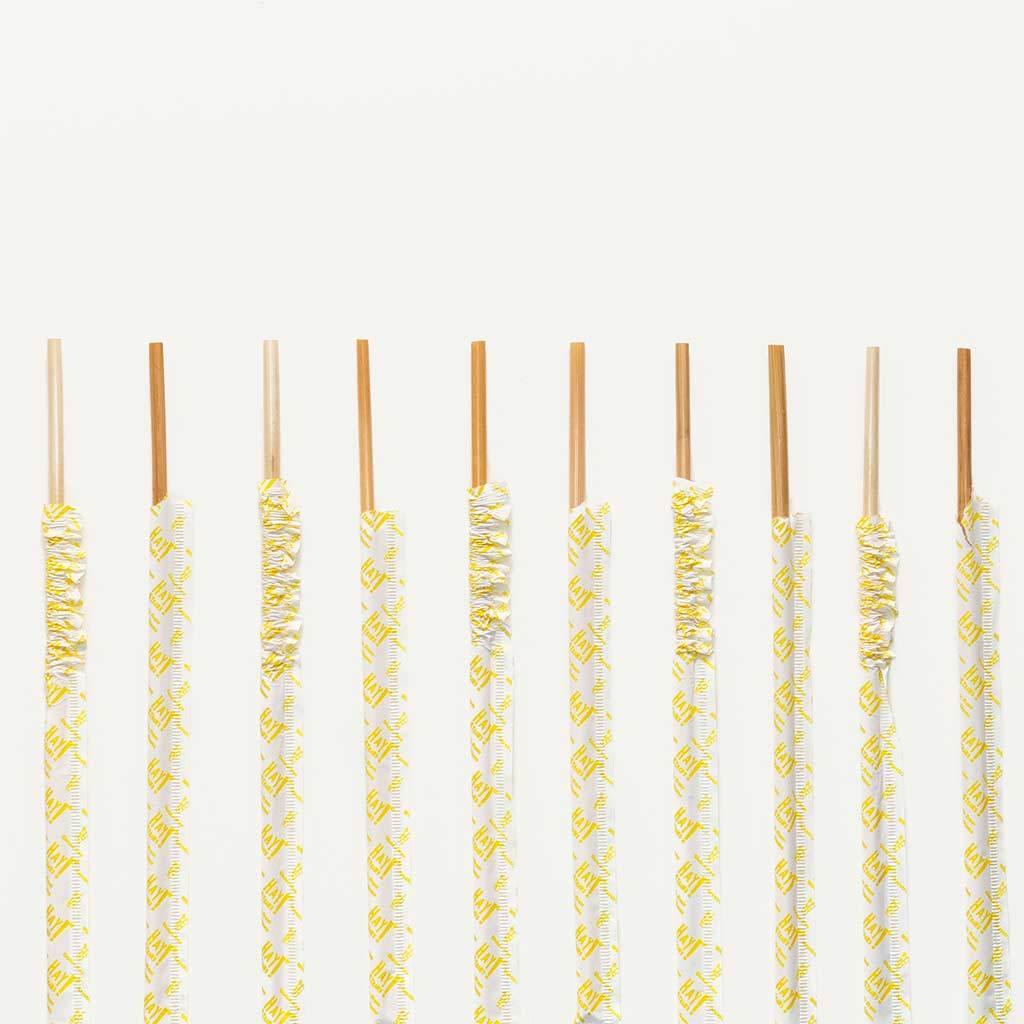couple of biological tall size paper wrapped wheat straws